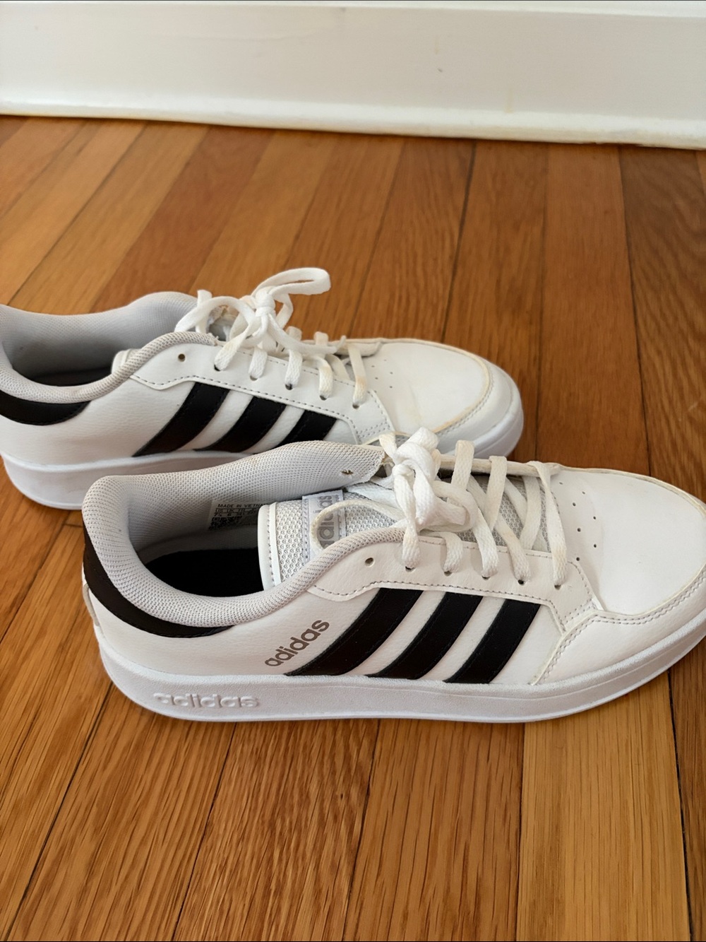 adidas women’s White and Black Low-Top Sneakers
